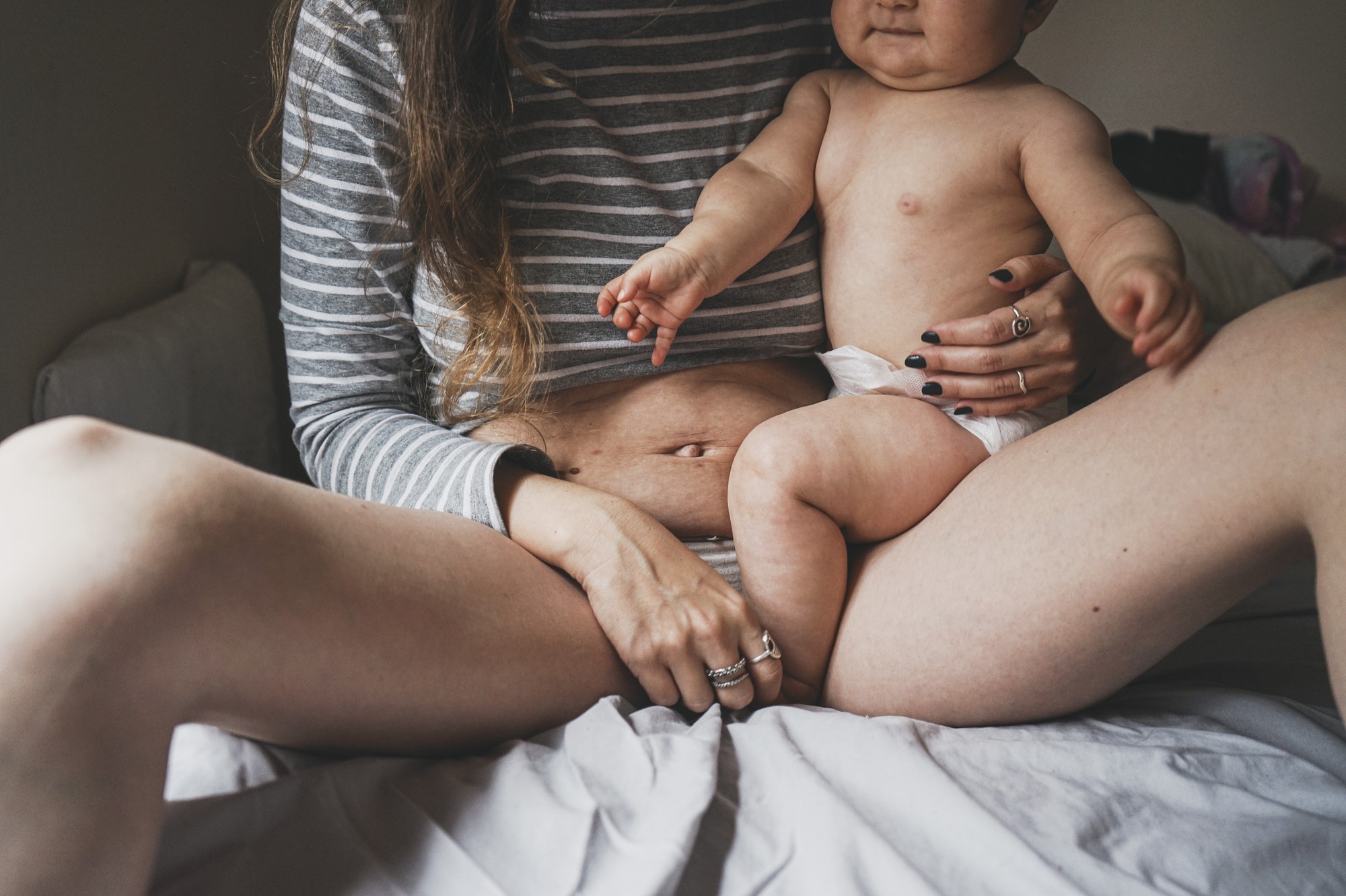 Real image of a woman and her baby at postpartum recovery